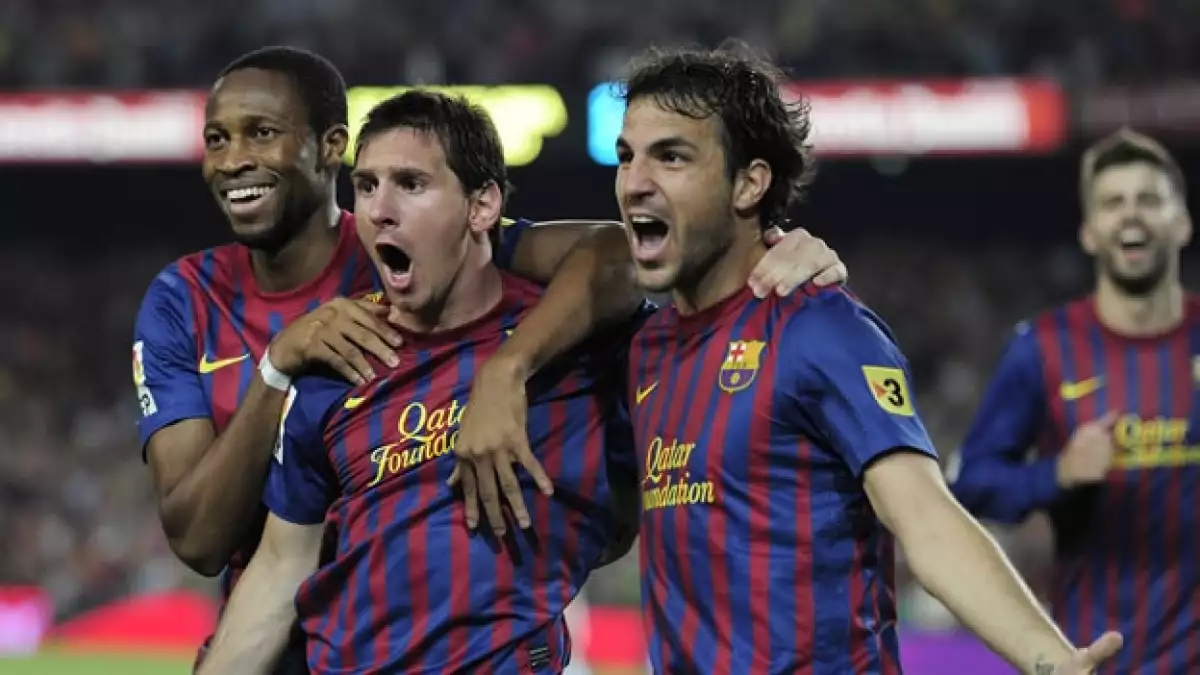 Messi y Fábregas celebran el triunfo del Barcelona