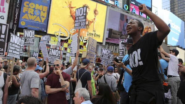 People gather for a vigil in response to the death of a counter-demonstrator