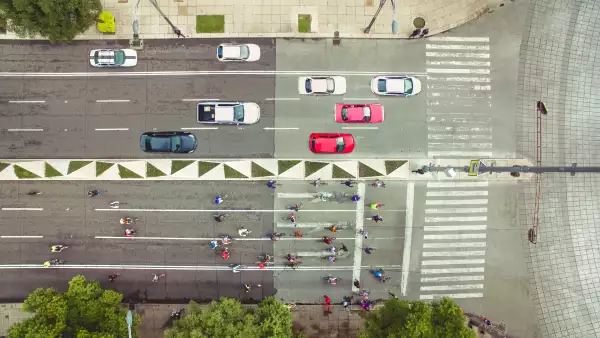 Top view of cars and bikes in avenue