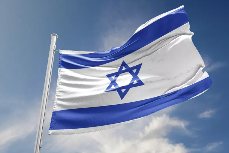 Israel Flag is Waving Against Blue Sky