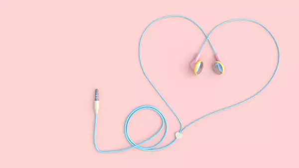 earphones pink color heart shape on pastel pink background