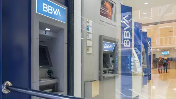 Outside and inside ATM's in a BBVA office in the center of Denia (Alicante). Horizontal composition.