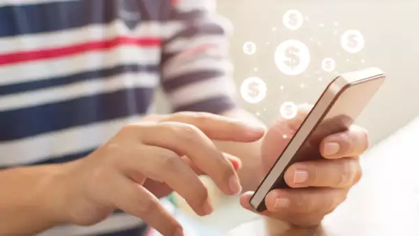Close up image hand using mobile phone with online transaction application, Concept financial technology (fintech)