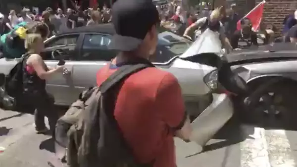 A vehicle plows into the crowd gathered on a street in Charlottesville