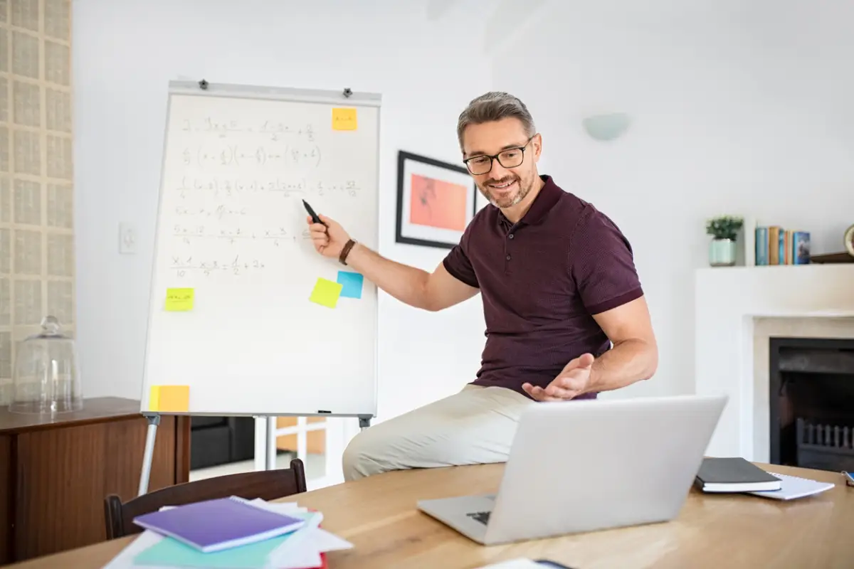 Teacher explaining during online lesson on video call from home