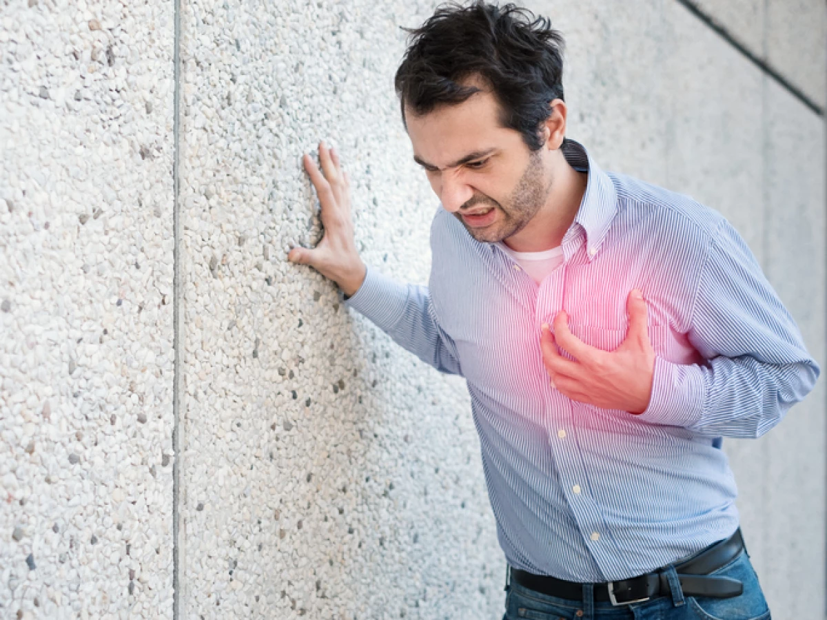 Man feeling a big pain on the chest and collapsing