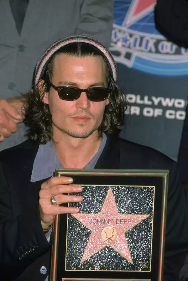 Johnny Depp Holding His Star