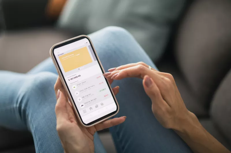 Woman managing online banking at home.