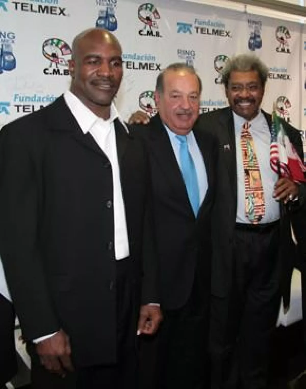 Evander Holyfield, Carlos Slim y Don King.