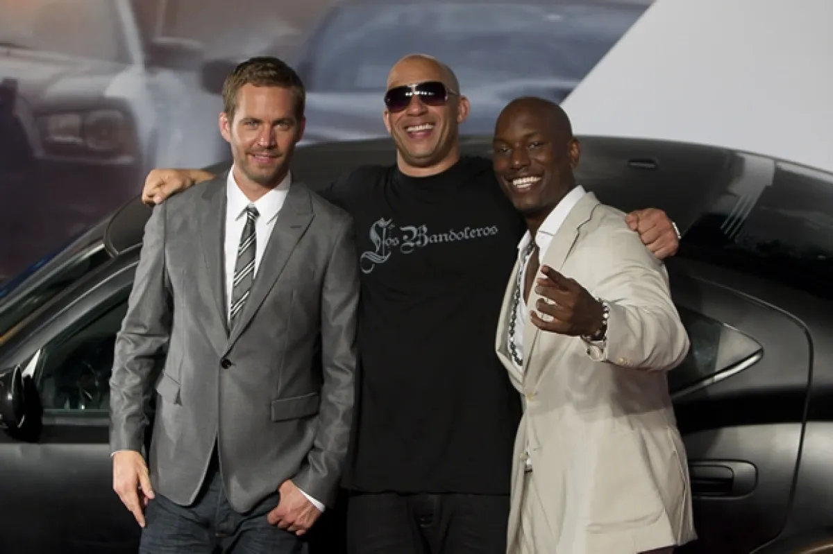 Paul con Vin Diesel y Tyrese Gibson en 2011.