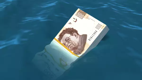 Money sinking in water
