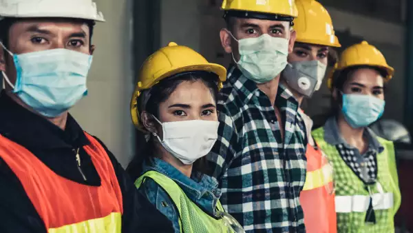 Workers with face mask protect from outbreak of Corona Virus Disease 2019.