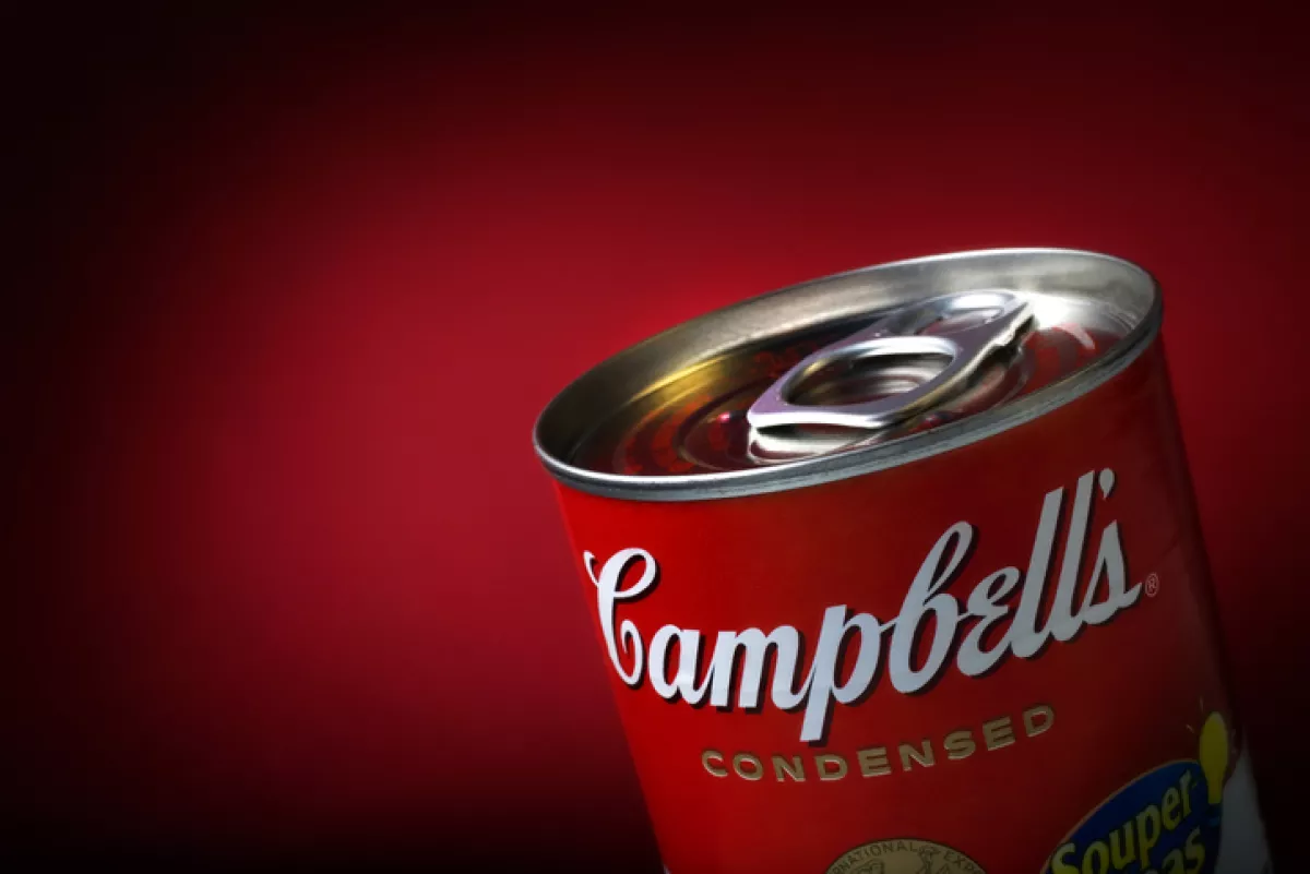 Close-Up of a Sealed Campbell's Soup Can on Red Background