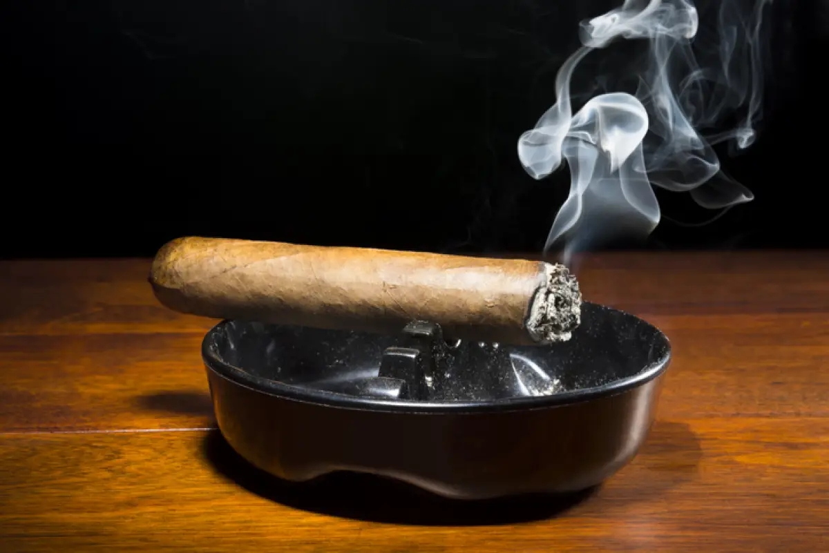 Cigar smoking in ashtray