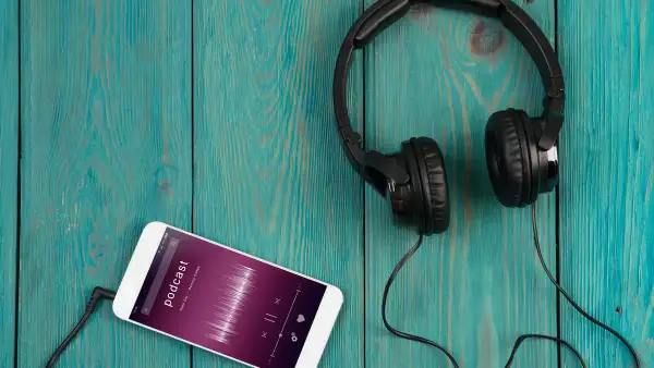 phablet and headphones on the wooden desk