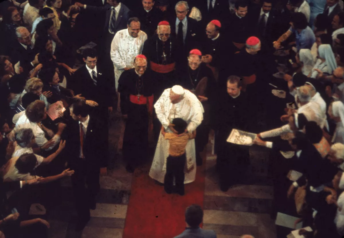 John Paul II Embraces Child
