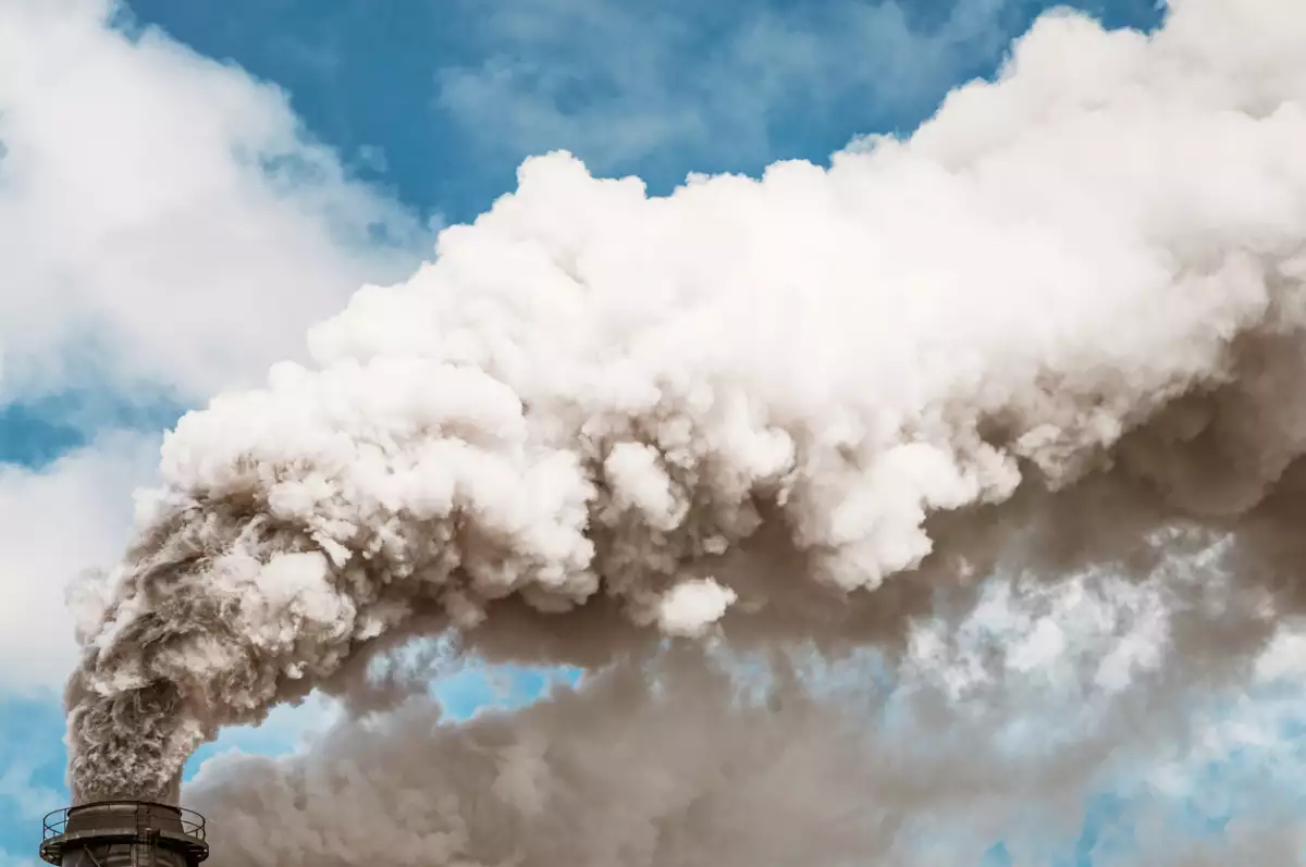 Thick smoke coming from an industrial chimney