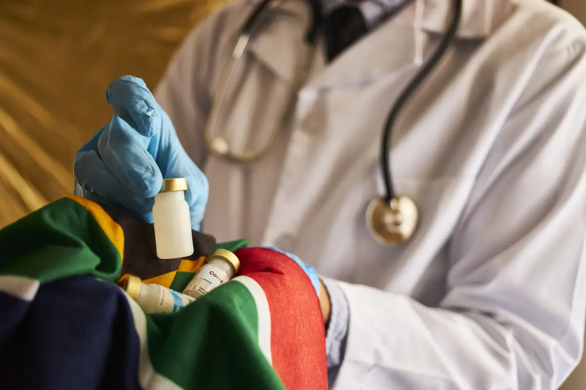 Doc holding vaccine for South Africa