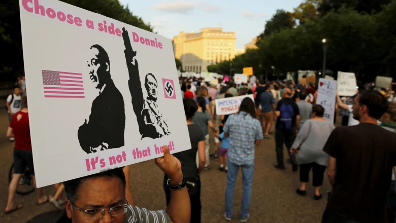 People gather for a vigil in response to the death of a counter-demonstrator