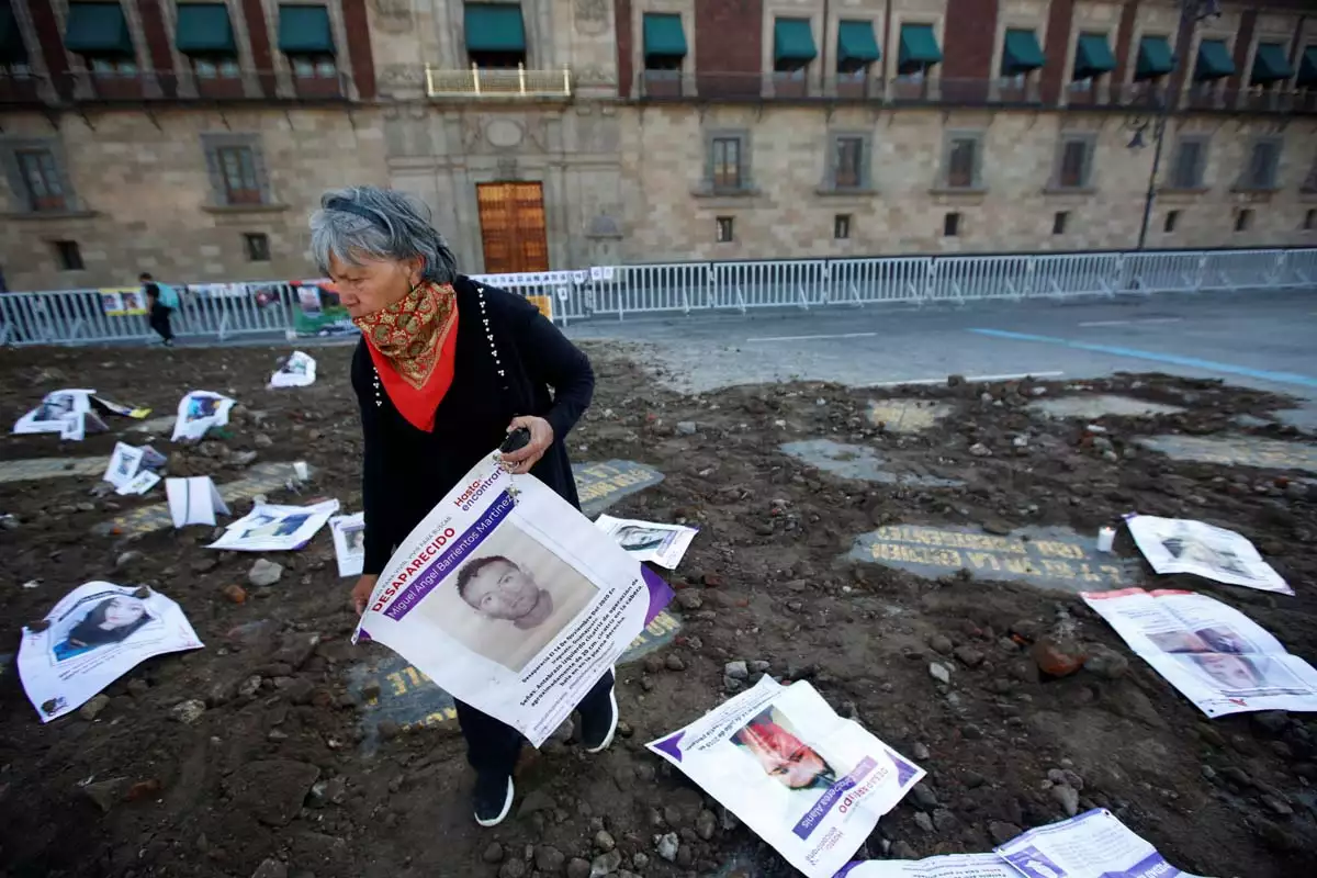 Relatives of missing persons protest outside the National Palace in Mexico City