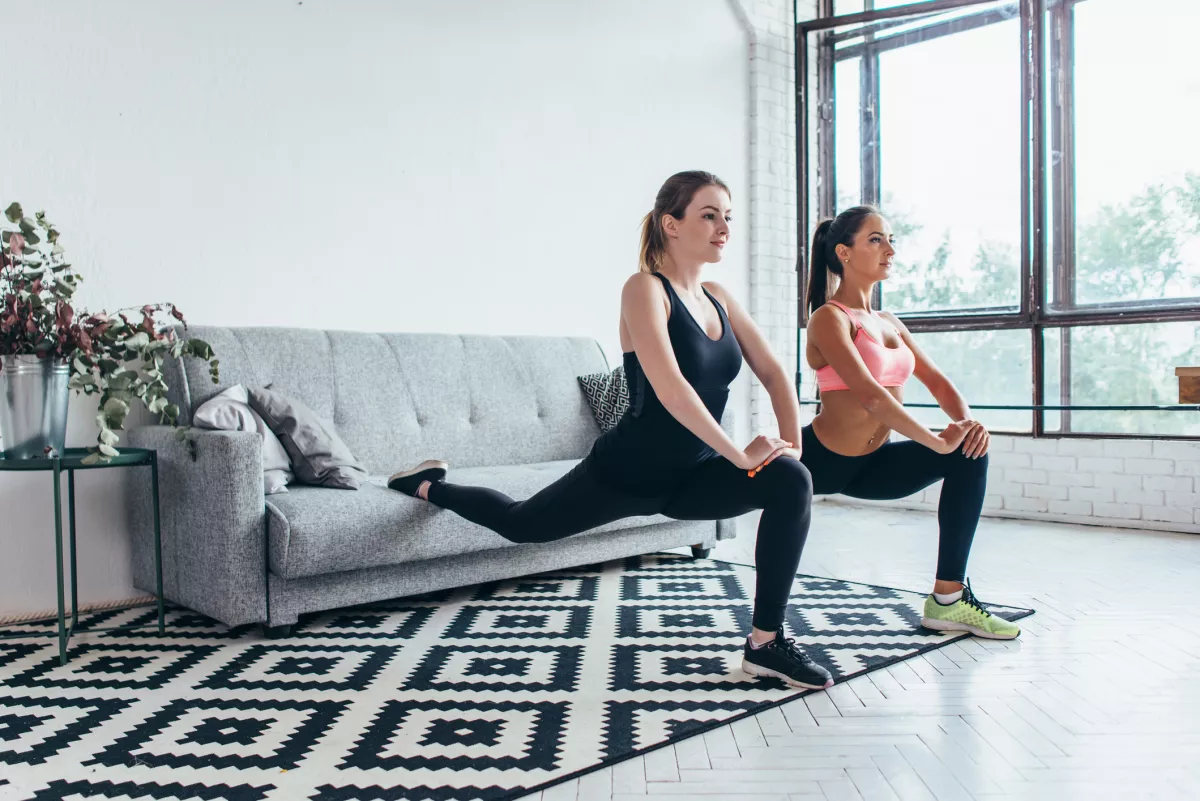 Fitness women doing front forward one leg step lunge exercises workout