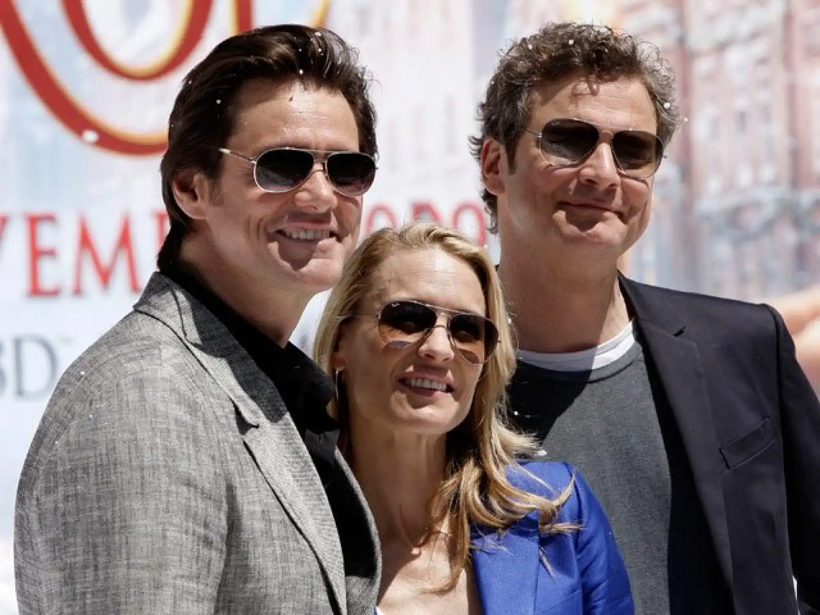 El canadiense Jim Carrey, el británico Colin Firthy la estadounidense Robin Wright Penn posan juntos antes de la presentación de "A Christmas Carol".