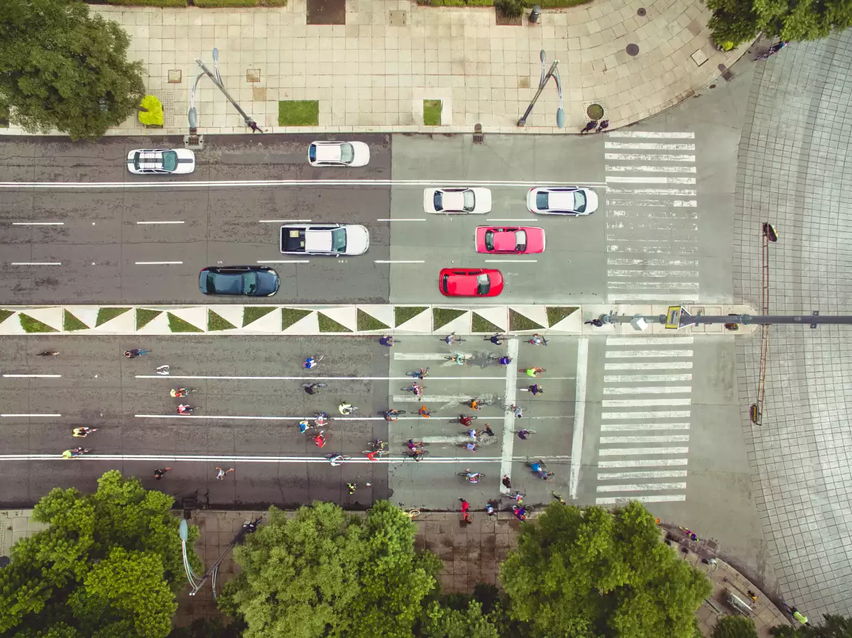 Top view of cars and bikes in avenue