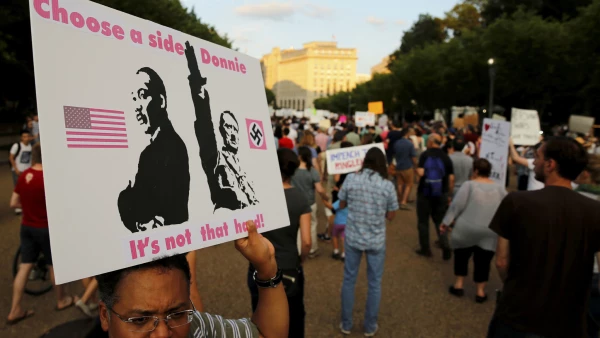People gather for a vigil in response to the death of a counter-demonstrator
