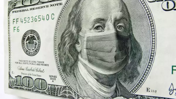 Ben Franklin wearing a Coronavirus Healthcare Mask on One Hundred Dollar Bill.