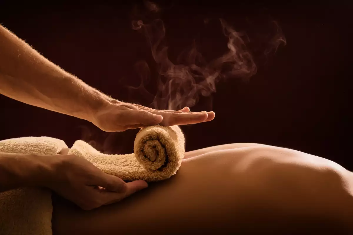 A,Professional,Therapist,Applies,A,Hot,Towel,On,The,Back
