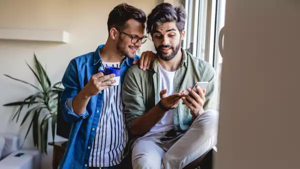 Gay men couple at home