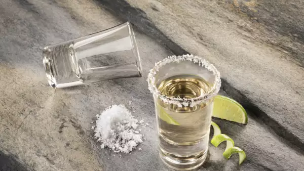 Mexican traditional drink accompanied with lime and salt