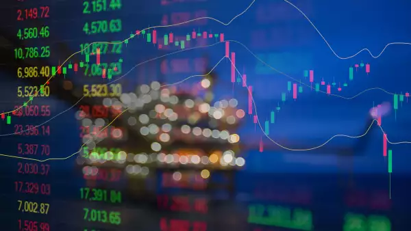 Graph of stock market data and financial with indicator, pricing display on offshore oil and gas processing platform background for world energy and oil price crisis concept.