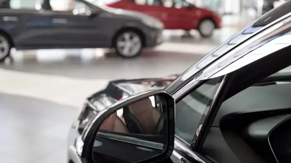 New cars at dealer showroom. Themed blur background with bokeh effect. Car auto dealership.