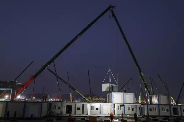 Workers labour at the construction site of the new Huoshenshan Hospital, a makeshift hospital for treating patients of the new coronavirus, in Wuhan