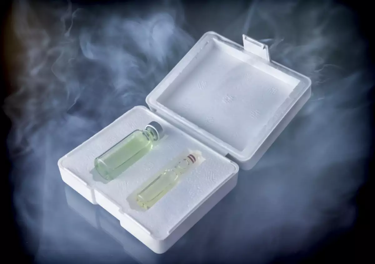 Isothermal box with two vaccines extracted of the freezer, conceptual image