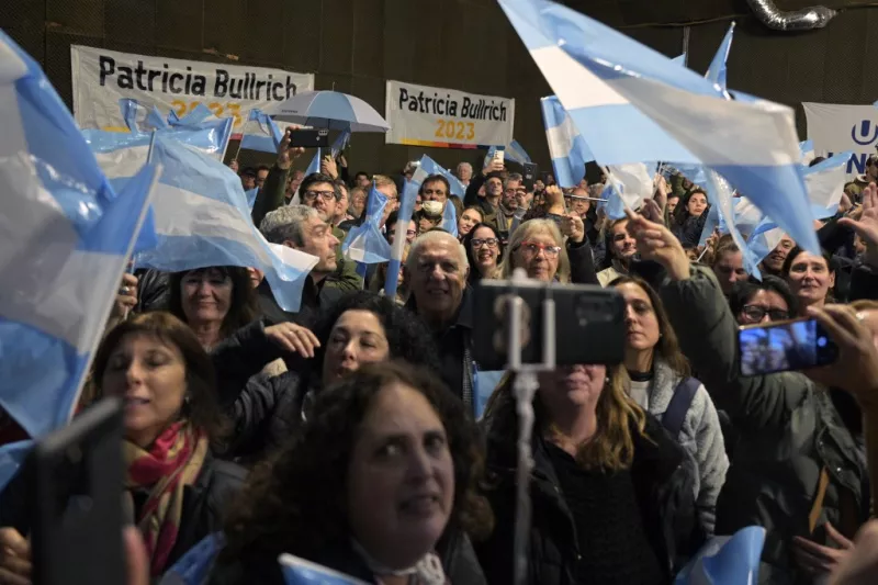 Supporters of Argentine presidential pre-candidate of Juntos por el Cambio party Patricia Bullrich (out of frame) listen to her speech during a closing rally of her campaign for the August 13 primary elections, in Buenos Aires on August 7, 2023. Argentina holds primary elections on August 13 and the first round of the presidential vote on October 22.