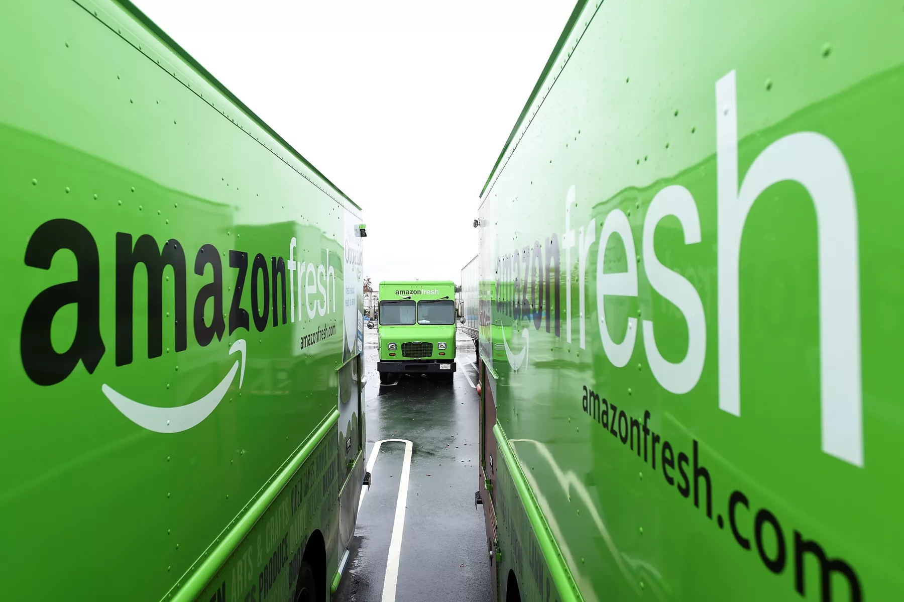 FILE PHOTO: An Amazon Fresh delivery truck sits parked outside an Amazon Fulfillment Center on Cyber Monday in Tracy