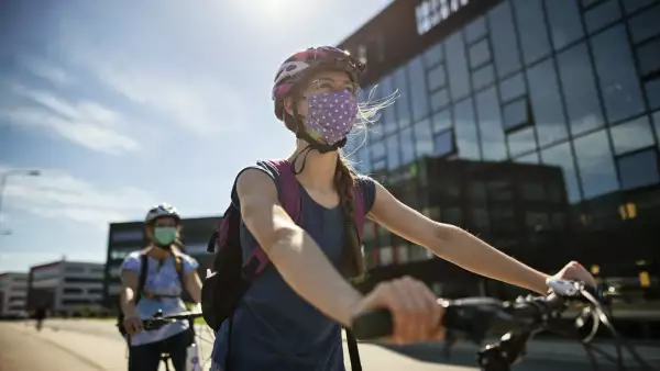 Mother and daughter riding bikes during Covid-19 pandemic