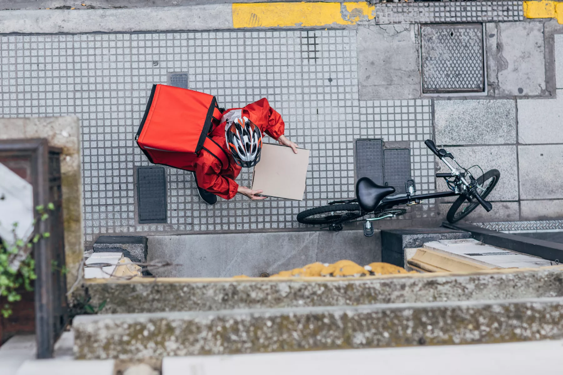 Man delivering pizza in city