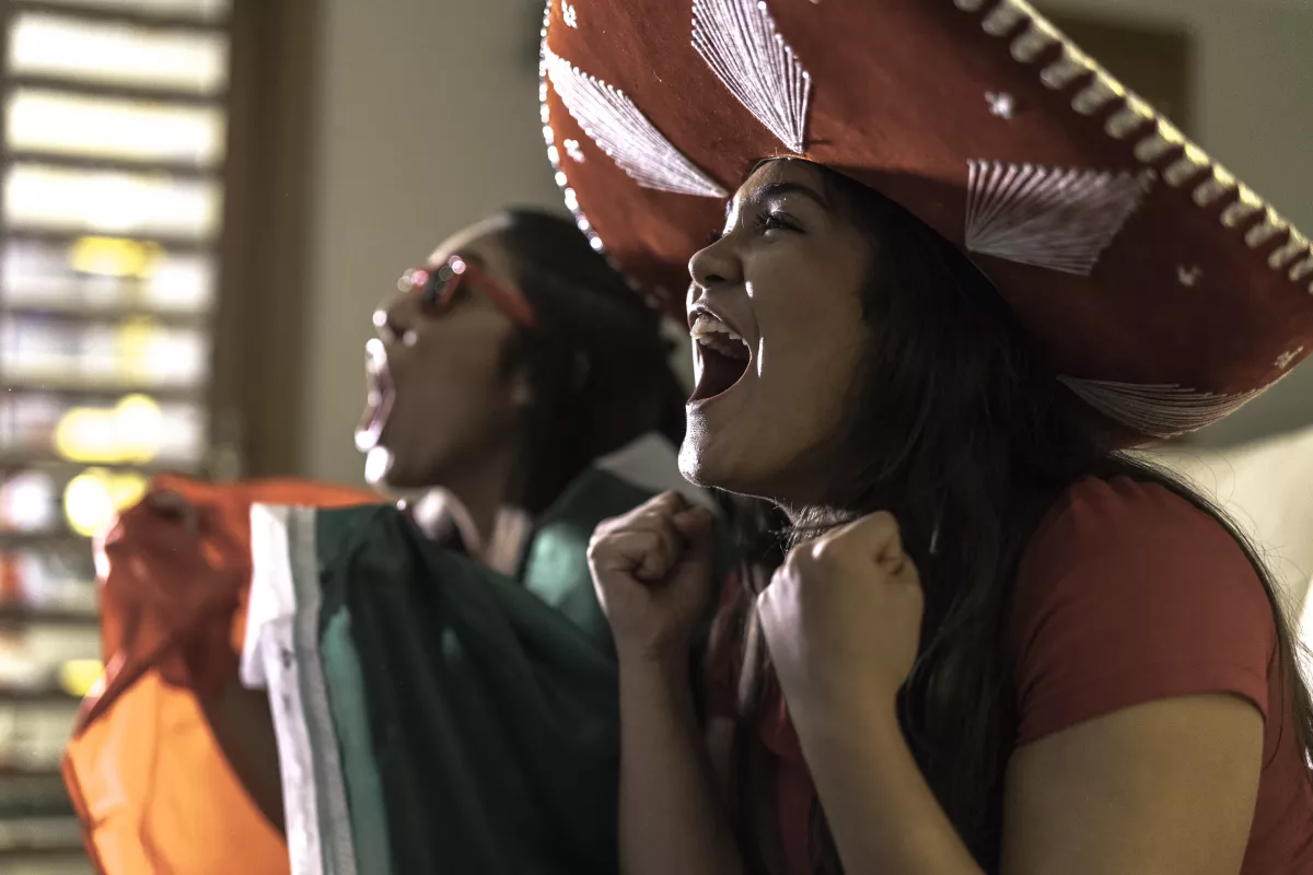 Mexican Fan Watching Sports and Celebrating at Home