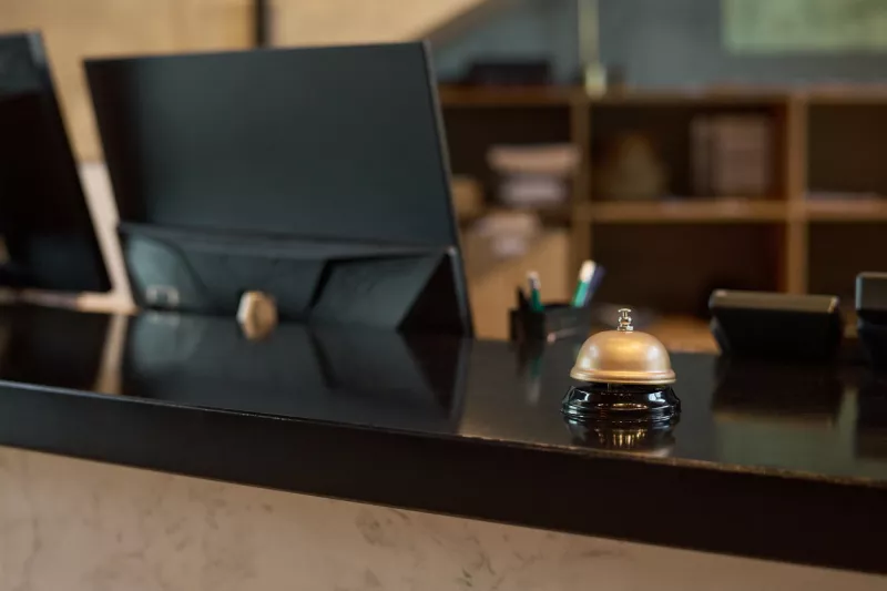 Hotel Reception Desk with Vintage Silver Bell