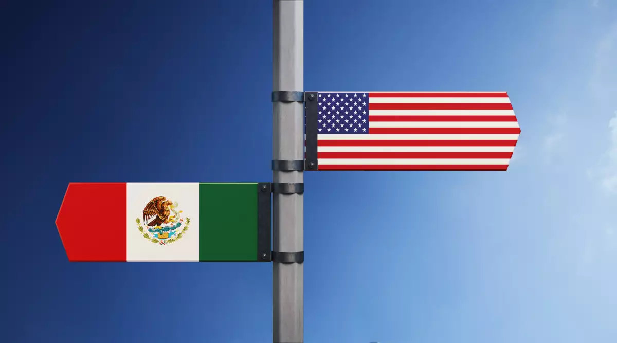 American And Mexican Flag Pair On Road Sign