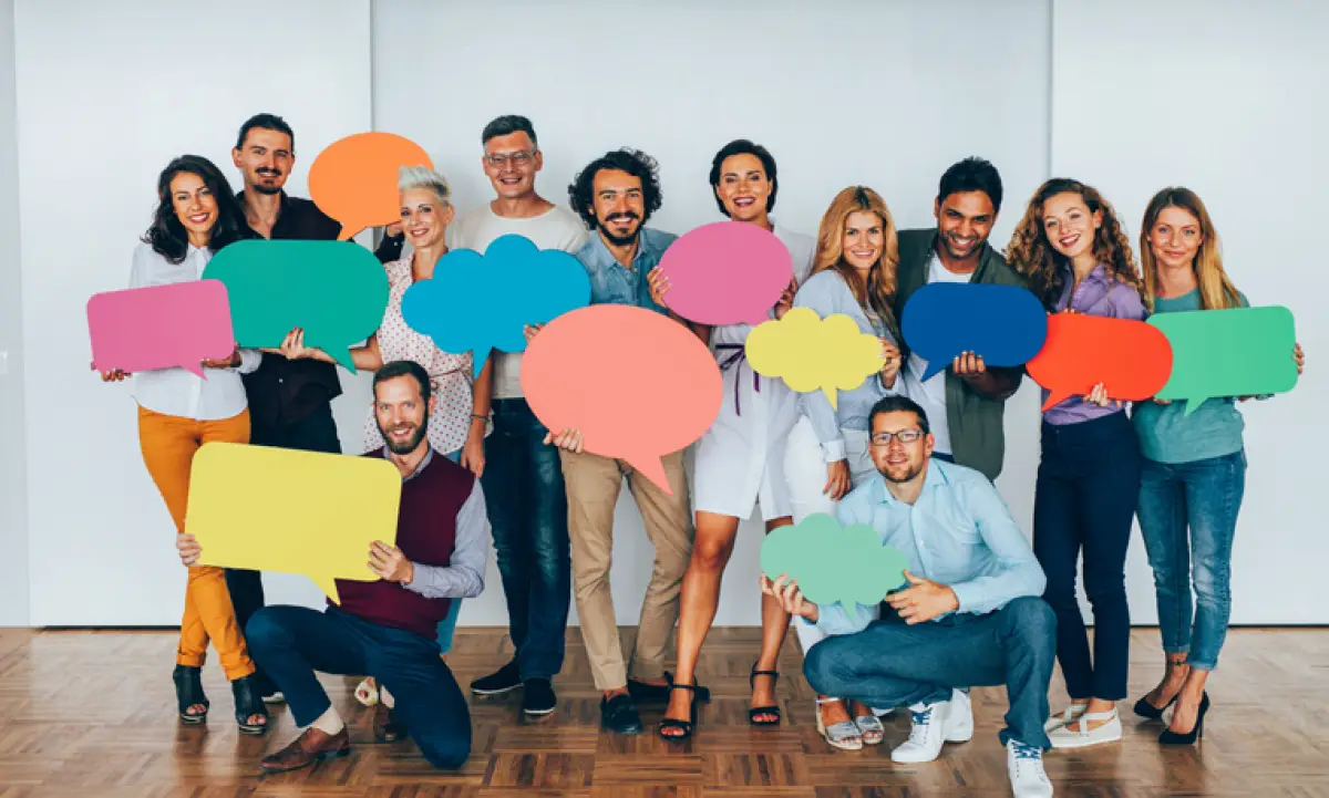 Businesspeople holding speech bubbles