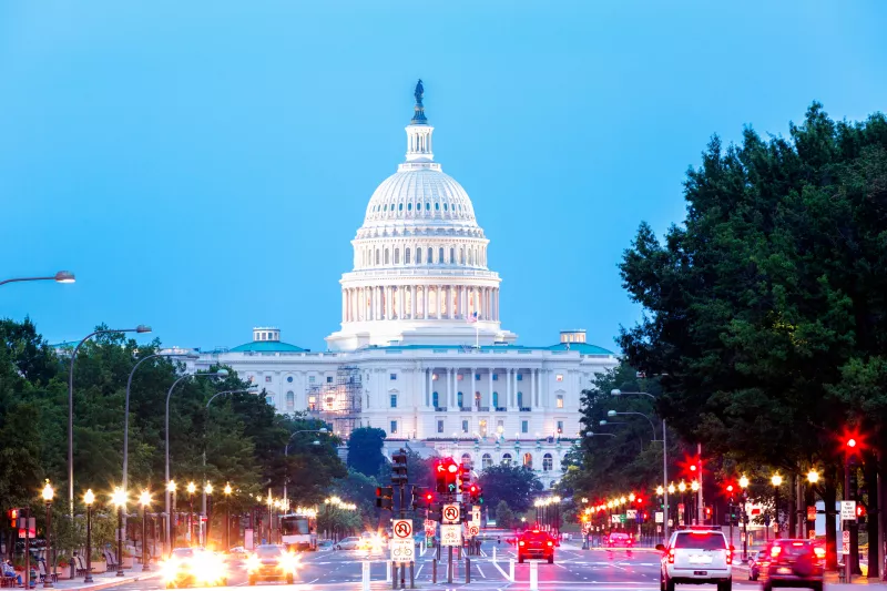 Capitol Building with Car Traffic Foreground