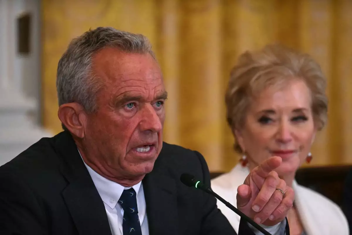 US Secretary of Health and Human Services Robert F. Kennedy Jr. (L) gestures as he speaks as US Secretary of Education Linda McMahon looks on during a MAHA (Make America Healthy Again) Commission Event in the White House in Washington, DC, on May 22, 2025.