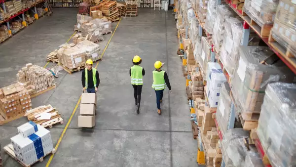 Workers working in large warehouse