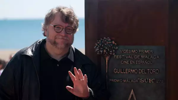 Mexican film director Guillermo del Toro poses next to a