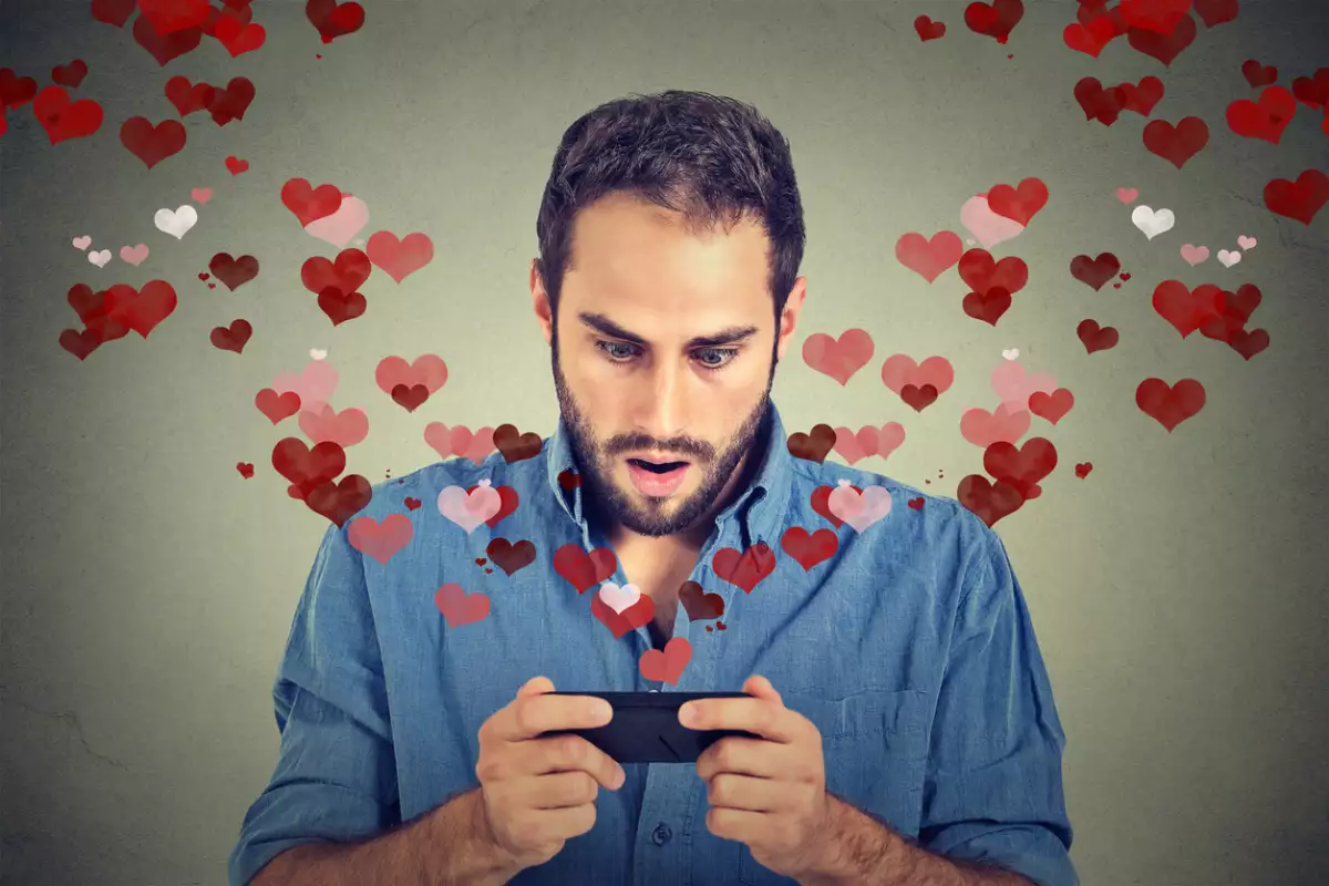young handsome shocked man sending receiving love sms
