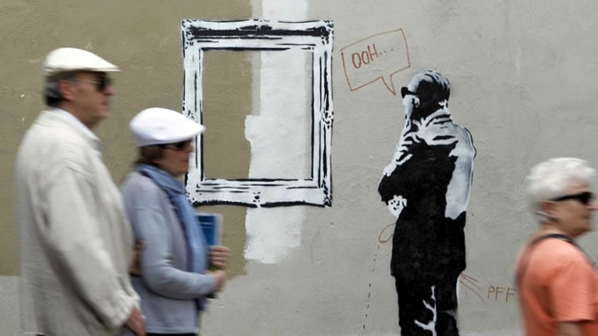 Un grafiti de Bansky en un muro español